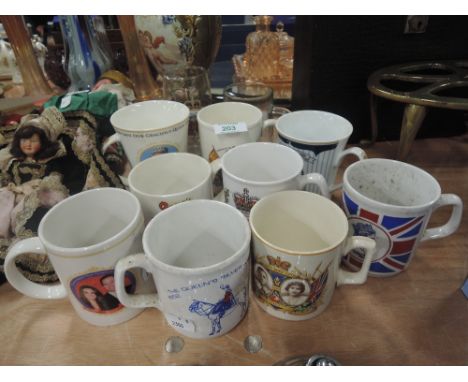 A selection of vintage coronation mugs and similar