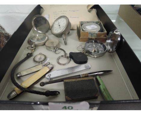 A selection of vintage compass and pen knife 