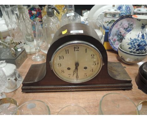 A vintage mantle clock in a Napoleon design