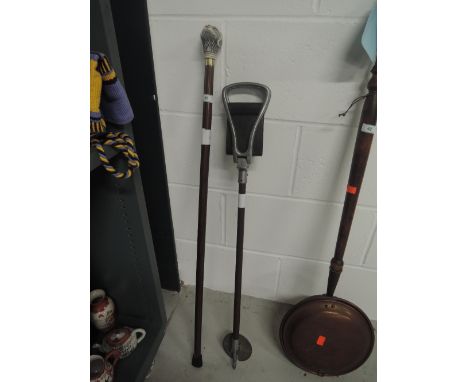 A vintage hunters shooting stick and similar hound head cane