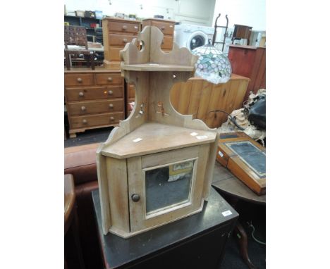 A 19th Century stripped pine corner wall shelf with mirrored cupboard under