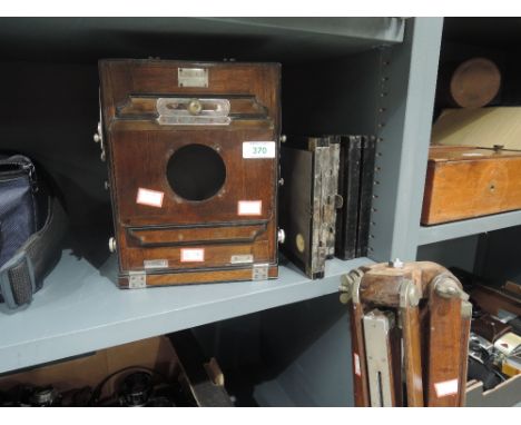 A Victorian rosewood cased field camera marked H G Vandenesse, Fontainbleau with four plates and rosewood tripod
