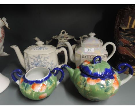 A selection of vintage tea pots hand decorated and transfer print