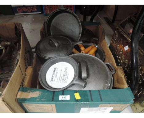 A selection of vintage country ironware pots pans and skillet