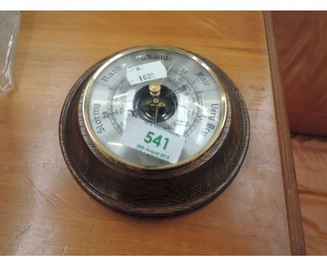 A small oak-cased wall barometer 
