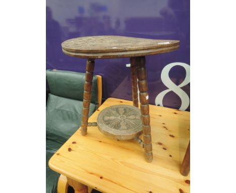 An early 20th century hardwood occasional table having circular top of Scottish design having celtic and thistle decoration o