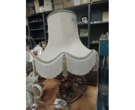 A vintage table top lamp and clock