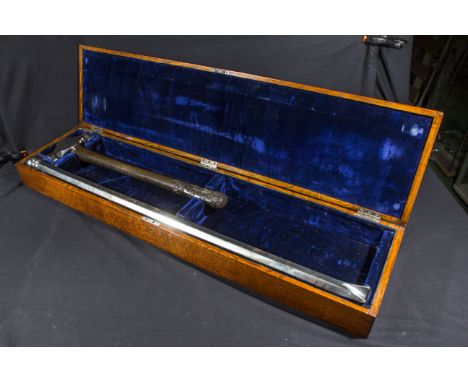 A Very large and heavy ceremonial hammer and chisel made of steel in an Oak case. Glasgow corporation water works.used at Loc