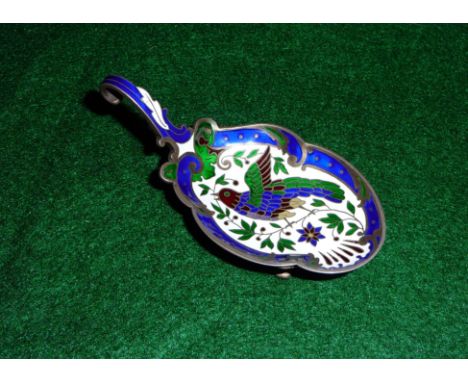 A silver spoon with enamel decoration