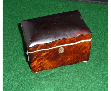 A tortoiseshell tea caddy
