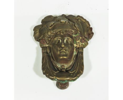 A Regency brass door knocker