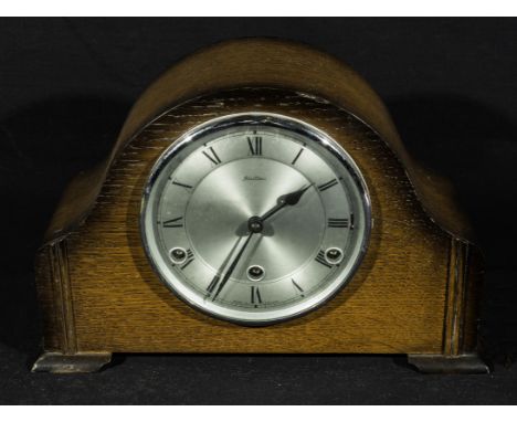 An oak mantle clock