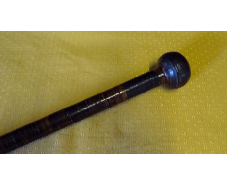 A leather bound walking stick