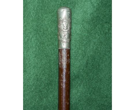 A silver topped swagger stick