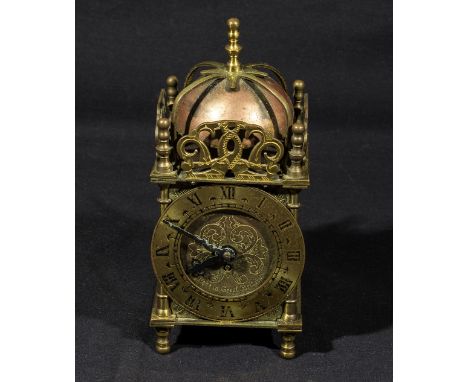 A brass lantern clock