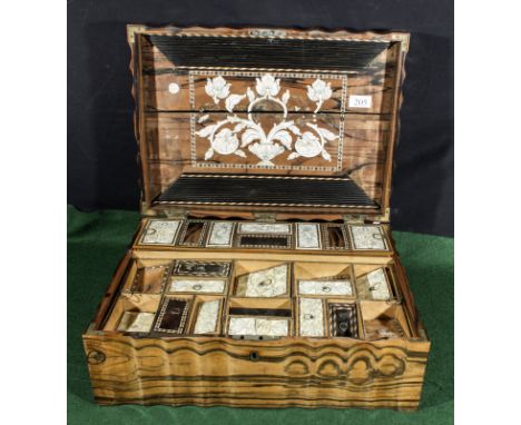 A Victorian coromandel wood Lady's trinket box interior has a pop up section. The box top is split and the interior needs som