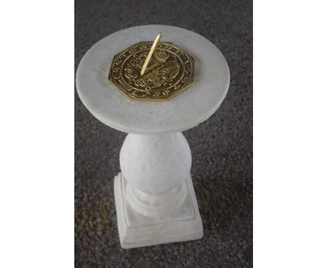 Composite formed plinth with a brass sundial, height approx 45cm