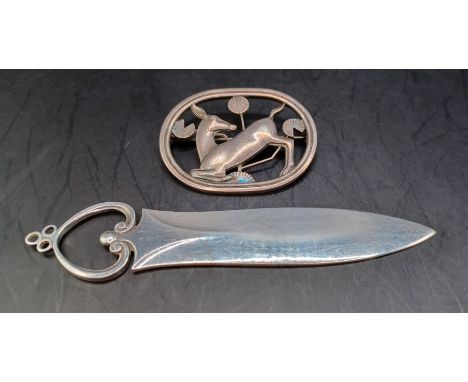 Two sterling silver items by Georg Jensen: a brooch 256 &amp; Paper Knife 254,&nbsp;designed by Arno Malinowski, depicting a 