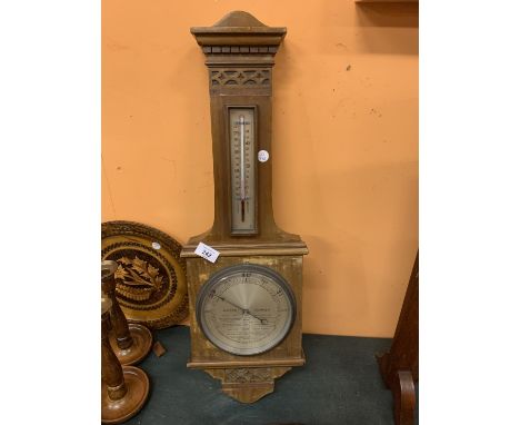 A WOODEN WALL-HUNG BAROMETER 