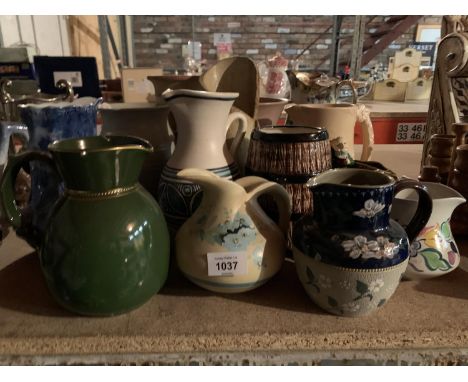 A COLLECTION OF VINTAGE AND RETRO CERAMIC JUGS OF VARIOUS DESIGNS 