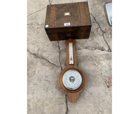 AN INLAID WALNUT JEWELLERY BOX AND AN OAK BAROMETER 