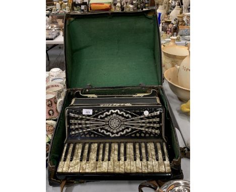 A DELFINI ACCORDIAN WITH MOTHER OF PEARL STYLE KEYS AND INLAID DETAIL TO INCLUDE CARRY CASE 