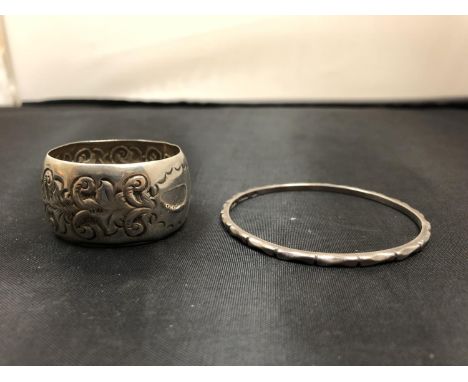 A SILVER NAPKIN RING AND BANGLE 