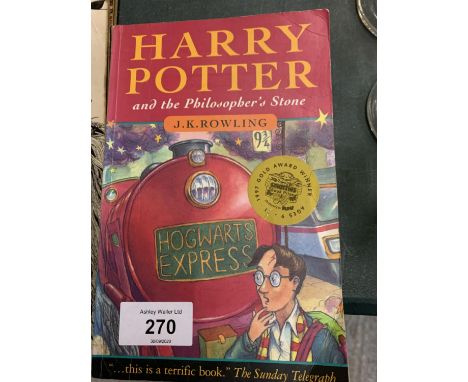 A FIRST EDITION PAPERBACK COPY OF 'HARRY POTTER AND THE PHILOSOPHER'S STONE' 