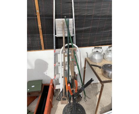TWO SETS OF STEP LADDERS, GARDEN TOOLS AND A CAST METAL GARDEN UMBRELLA BASE 