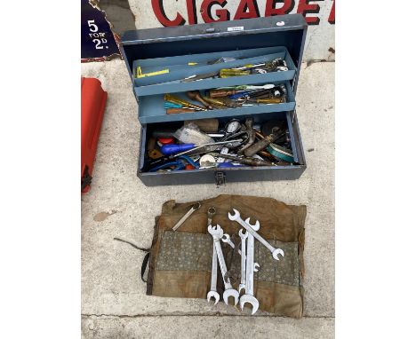 A METAL TOOL BOX AND VARIOUS SPANNERS AND TOOLS 