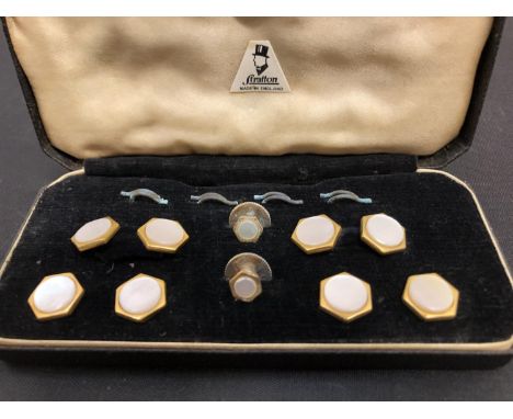 A MOTHER OF PEARL STUD SET 