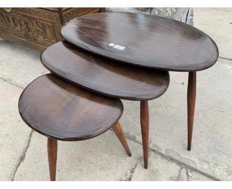 A NEST OF THREE ELM ERCOL PEBBLE TABLES 