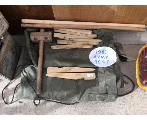 A 1985 GREEN CANVAS ARMY TENT WITH PEGS, TWO POLES AND A WOODEN MALLET 