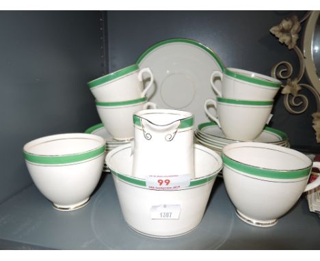 A vintage part tea service by TF and Sons in a white and green palette