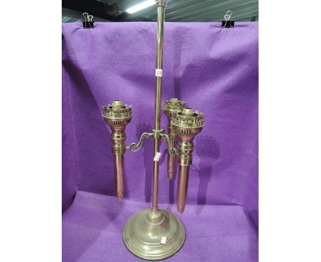 A vintage three stem brass light fitting