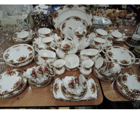 A large vintage part dinner and tea service by Royal Albert in the old country roses pattern 