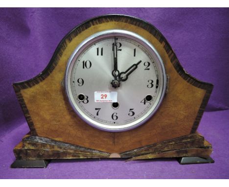 A vintage art deco design mantle clock with chime