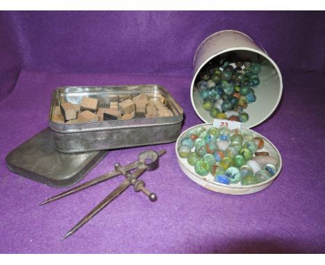 A selection of vintage alphabet stamp blocks and marbles 