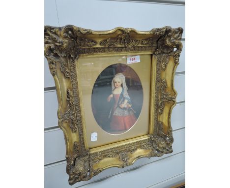 An ornate gilt and plaster frame with vintage print