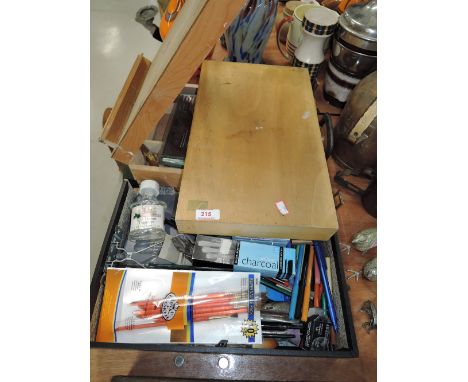 A selection of vintage artist supplies and art materials
