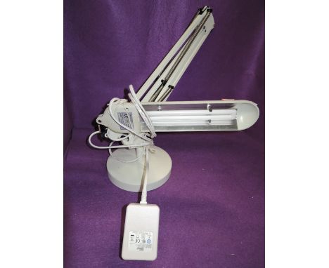 A vintage angle poise reading lamp