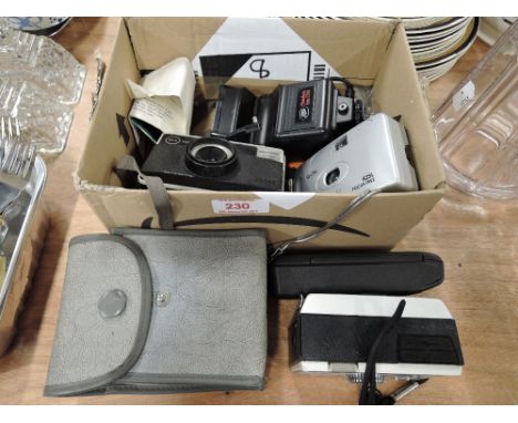 A selection of vintage cameras and photographic equipment 