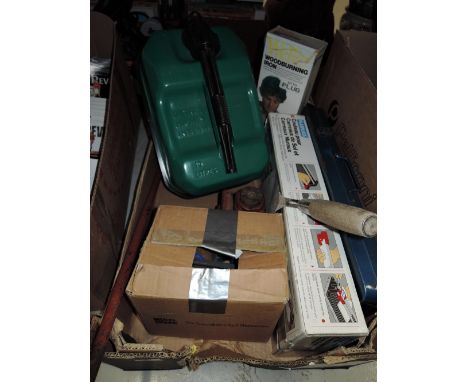 A selection of vintage garage and DIY tools including tile cutter