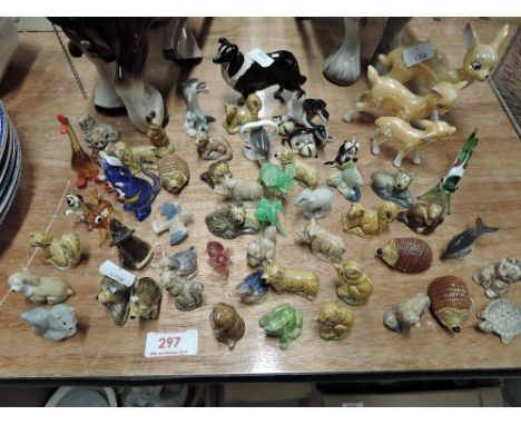 A selection of vintage miniature ceramic figures including Wade