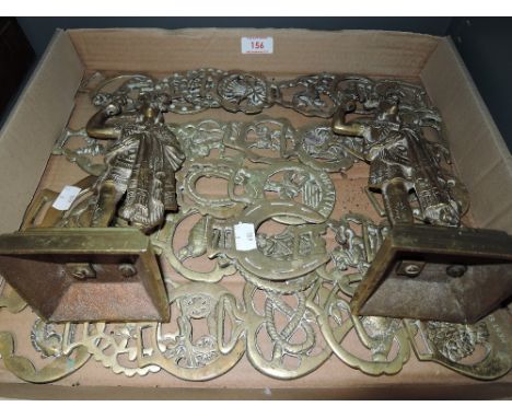 A selection of vintage horse brass and pair of tribal design figures