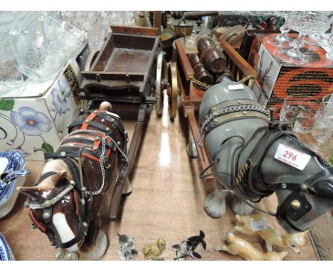 Two vintage ceramic horse figures and carts