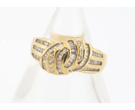 An 18ct yellow gold diamond set knot dress ring, baguettes and brilliant cuts, ring size M, 4.6g 