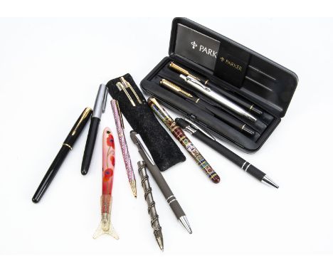 A vintage Parker fountain pen, with an 18ct gold nib, together with modern Parker fountain pen and roller ball pen set in box