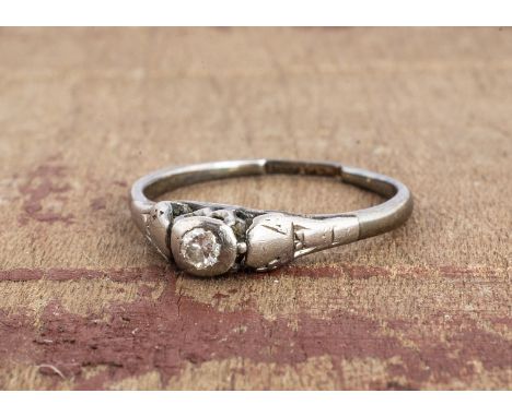 A small diamond solitaire, in silver setting and shank, af, possible ring size M