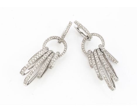 A pair of continental white metal and diamond chandelier drop earrings, the oval hoops with a circular link, supporting oval 